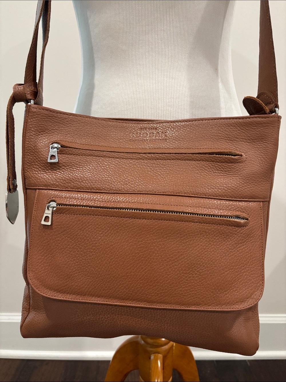 RUDSAK Tan Pebbled Leather Crossbody Bag with Front Zip Pockets